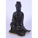 A 17TH CENTURY CHINESE BRONZE FIGURE OF GUANYIN Ming, modelled in robes. 11 cm x 3 cm.