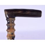 A 19TH CENTURY MIDDLE EASTERN CARVED HORN FULL LENGTH WALKING CANE of tapering form. 280 grams. 85 c