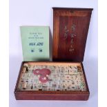 AN EARLY 20TH CENTURY CHINESE CARVED IVORY MAHJONG SET within a fitted case. 28 cm x 15 cm.