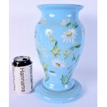 A LATE VICTORIAN BLUE OPALINE GLASS VASE enamelled with foliage. 28 cm high.