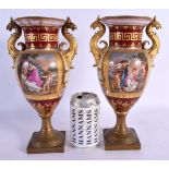 A PAIR OF 19TH CENTURY TWIN HANDLED VIENNA PORCELAIN VASES with bronze mounts. 28 cm x 12 cm.