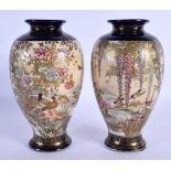 A PAIR OF LATE 19TH CENTURY JAPANESE MEIJI PERIOD SATSUMA VASES painted with landscapes. 20 cm high.
