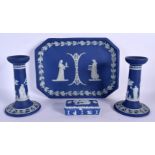 AN UNUSUAL WEDGWOOD BLUE BASALT DESK SET decorated with classical figures. Largest 25 cm wide. (4)