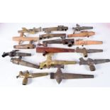 A collection of brass antique beer taps together with wooden taps largest 23 cm (17)
