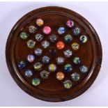 A SOLITAIRE MARBLE BOARD with marbles. Board 18 cm diameter. (qty)
