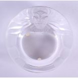 A FRENCH LALIQUE GLASS ASHTRAY formed with a lion. 14 cm diameter.