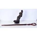 AN AFRICAN HARDWOOD TRIBAL STAFF and a similar figure. Largest 89 cm long. (2)