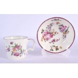 18th c. Mennecy cup and saucer painted with coloured flowers flowers with puce border and handle. Cu