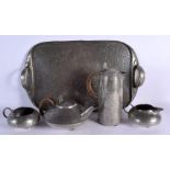 AN ARTS AND CRAFTS STYLE ENGLISH PEWTER TEASET with tray, decorated with scrolling foliage. Largest