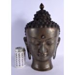 A LARGE 19TH CENTURY CHINESE BRONZE BUDDHA HEAD with moonstone inlay. 38 cm x 14 cm.