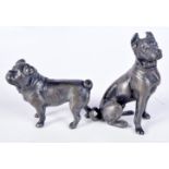 A small cast metal WMFB stamped model of a dog together with another smaller model 7 cm (2).