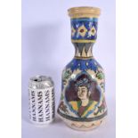 A MIDDLE EASTERN FAIENCE POTTERY HOOKAH PIPE BASE painted with portraits. 29 cm high.