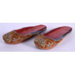 A PAIR OF 19TH CENTURY CHINESE SILK WORK SLIPPERS Late Qing. 22 cm long.