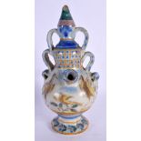 AN 18TH CENTURY EUROPEAN FAIENCE GLAZED PUZZLE TYPE JUG painted with birds. 21 cm high.