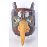 A North American Indian Haida wooden mask. 22 cm .