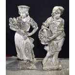 A pair of large stone statues of a boy and a girl fruit pickers from the gardens of The Burrows pri