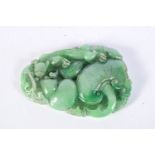 A small Chinese carved Jade boulder of a Lizard on a fruiting pod 9 x 6.5 cm.