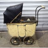 A vintage child's tin plate pram together with two vintage soft toys
