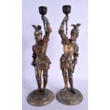 A LARGE PAIR OF ANTQUE COLD PAINTED CONTINENTAL METAL CANDLESTICKS formed as Knights. 39 cm high.