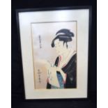 A framed Japanese print of a female 28 x 18 cm