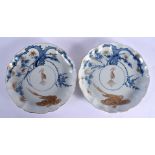 A PAIR OF LATE 18TH CENTURY JAPANESE EDO PERIOD SCALLOPED DISHES painted with storks. 20 cm wide.