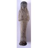 AN EGYPTIAN STONE USHABTI. 13 cm high.