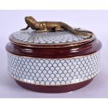 A CONTEMPORARY BRONZE AND POTTERY BOX AND COVER. 12 cm diameter.