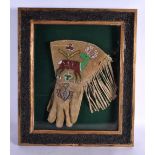 A RARE EARLY 20TH CENTURY NORTH AMERICAN TRIBAL BEADWORK GLOVE decorated with reindeer and flowers.