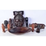 A collection of African tribal wooden carvings and a terracotta head . largest 40 cm.(10)