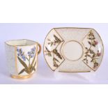 Royal Worcester Japanese style moulded cup and saucer with prunus and primroses date mark 1889.