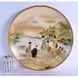 A LARGE EARLY 20TH CENTURY JAPANESE MEIJI PERIOD SATSUMA CHARGER painted with geisha. 40 cm diameter