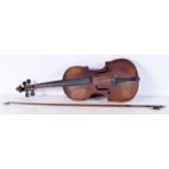 A violin and bow. 35 cm.(2).