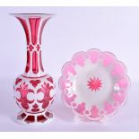 A BOHEMIAN RUBY AND WHITE OVERLAID FLASH VASE ON STAND decorated with motifs. 27 cm high.