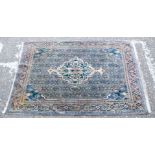 A Persian rug 115 x 164 cm.