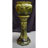 A LARGE ANTIQUE MAJOLICA SCALLOP SHELL PLANTER ON STAND. 100 cm x 40 cm.