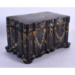 A VICTORIAN BLACK LACQUER MOTHER OF PEARL INLAID TEA CADDY decorated with foliage. 17 cm x 12 cm.
