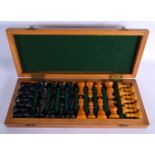 A VERY RARE CASED ART DECO BAKELITE CATALIN CHESS SET within a fitted case. Largest 7.25 cm high. (q