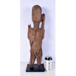 A LARGE TRIBAL CARVED WOOD FIGURE modelled as a female. 40 cm high.