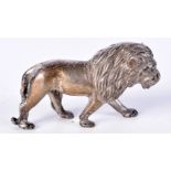 A WHITE METAL MODEL OF A ROAMING LION. 6cm x 3.5cm, weight 64g