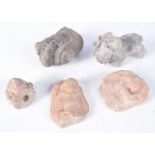 A collection of early Indian carved stone fragments largest 10 cm .(5).