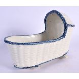 A LATE 18TH/19TH CENTURY PEARLWARE MODEL OF A BABIES CRIB with blue border. 14 cm x 10 cm.