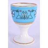 Royal Worcester rare egg cup designed in the style of Sir Christopher Dresser with a turquoise groun