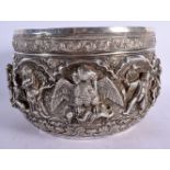 A FINE LARGE 19TH CENTURY BURMESE SILVER BUDDHISTIC BOWL decorated with figures in various pursuits.