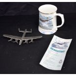 A Dam Busters porcelain tankard together with a Pewter model of a Dam busters plane largest 21 cm (2