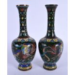 A PAIR OF LATE 19TH CENTURY JAPANESE MEIJI PERIOD CLOISONNE ENAMEL VASES decorated with birds. 16.5