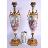 A LARGE LATE 19TH CENTURY FRENCH SEVRES PORCELAIN VASES with champleve enamel mounts. 39 cm high.