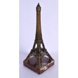 AN UNUSUAL EARLY 20TH CENTURY FRENCH GILT METAL AND MARBLE MODEL formed as the Eiffel tower. 27 cm h