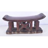 An African Tribal hard wood carved head rest. 11 x 23 x 8cm.