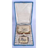 AN ART DECO IVORINE SILVER INLAID LADIES CASED PURSE AND BOOK. Largest 10 cm x 7 cm.