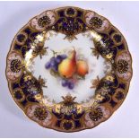 Royal Worcester plate finely painted with fruit under a blue and raided gilt border by R. Sebright,